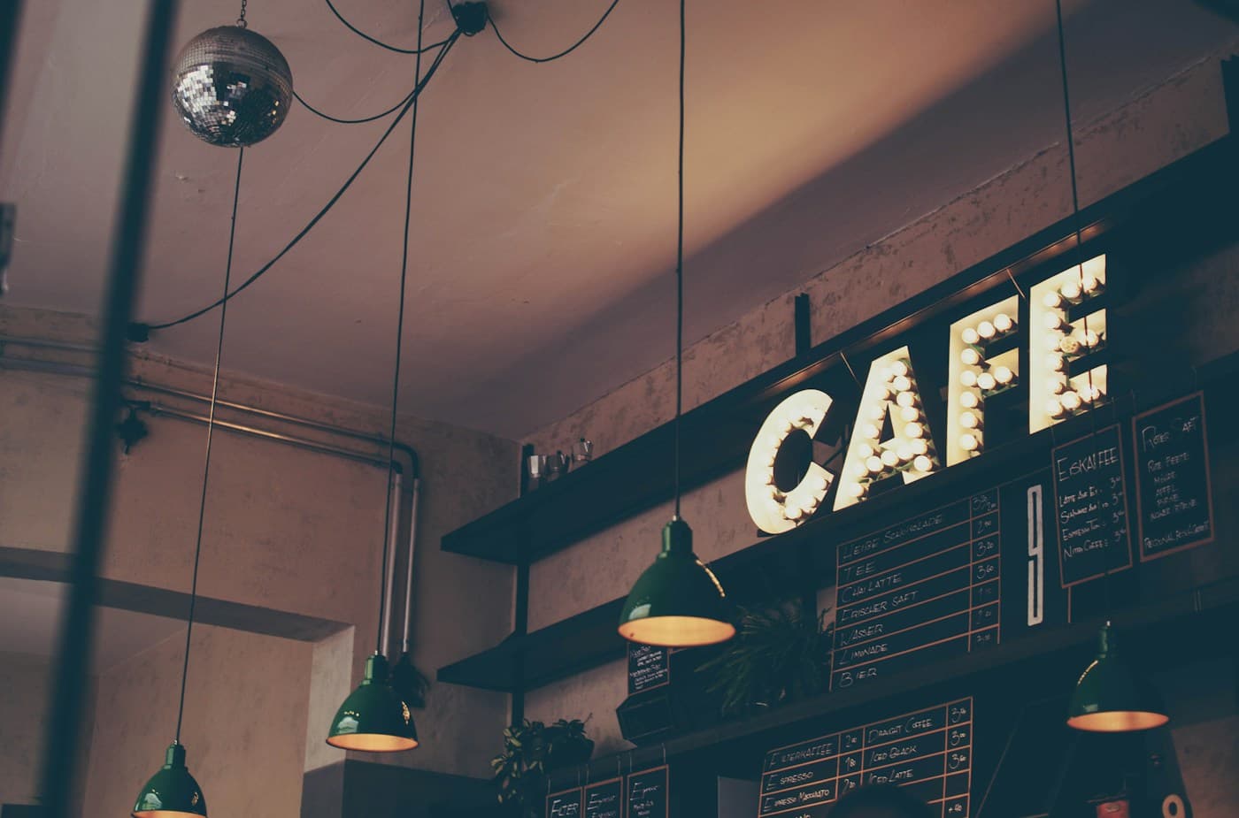 Warm café interior with pendant lights and a welcoming coffee counter